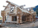 Slokana construction photo :- Side and back of log home at Slokana's log yard.