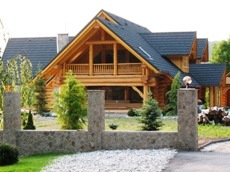 Log Home stain after roof has been completed.